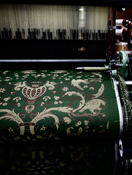 Fabric being machine woven